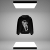 Black Astronaut Printed Hoodie displayed under modern studio lighting, featuring a bold space-themed graphic on the front.